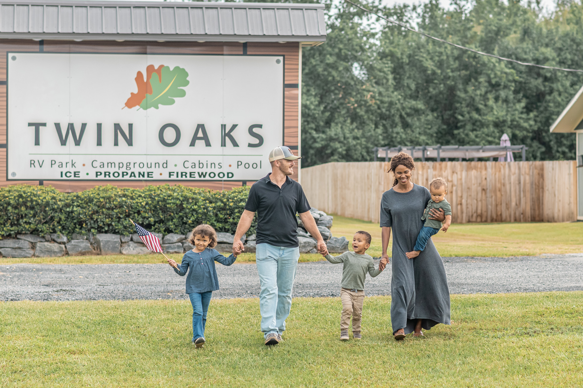 Happy RV travelers at Twin Oaks RV Park entrance near I-75 in Elko, GA