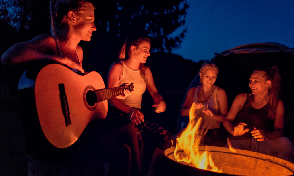 RV travelers around campfire during Fall RV trip in North Florida