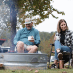 Full time RVers enjoying the holidays around the fire at Rivertown Rose Campground