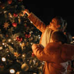 Children admiring a Christmas tree at a festive tree lighting event.
