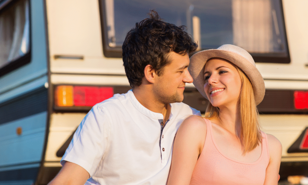 Couple relaxing at their RV site at Bayberry RV Park in Gulfport, MS during a Valentine’s Day Gulf Coast getaway.