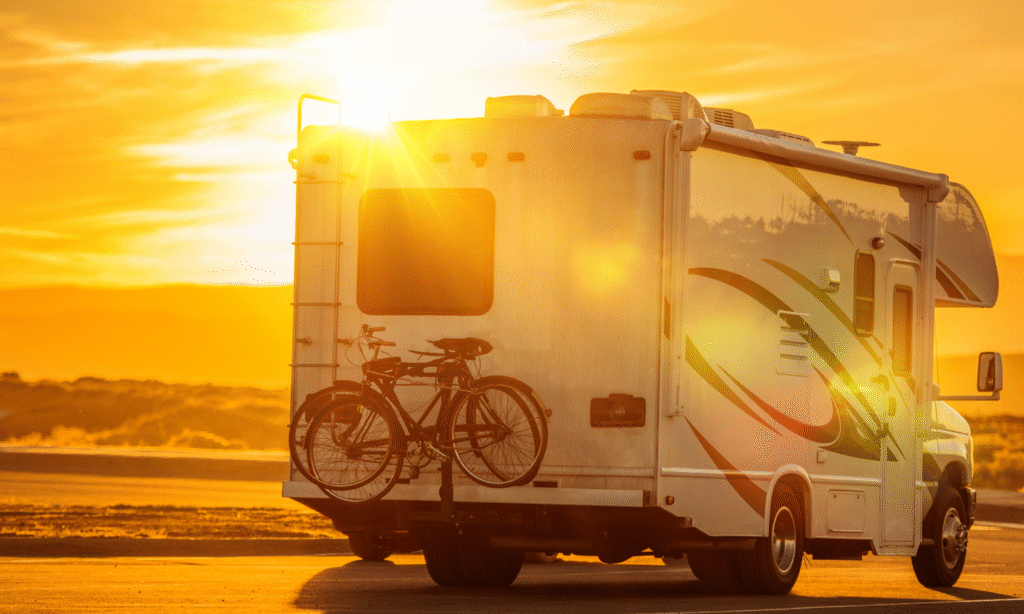 RV traveling at sunset near The Station RV Resort in Madison, Florida