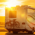RV traveling at sunset near The Station RV Resort in Madison, Florida