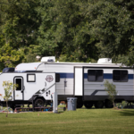 Spacious RV site at Bayberry RV Park with full hookups, shaded areas, and picnic table ready for a long-term stay on the Mississippi Gulf Coast.