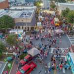 Festival with food trucks, vendors, and springtime crowds in Central Georgia near Twin Oaks RV Park.