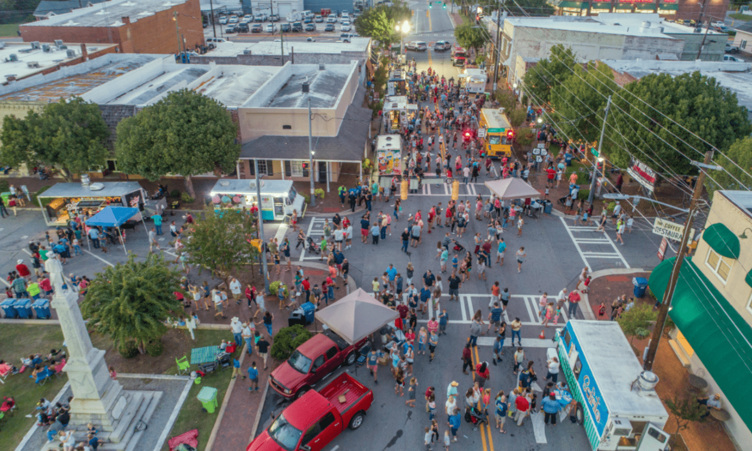 Festival with food trucks, vendors, and springtime crowds in Central Georgia near Twin Oaks RV Park.