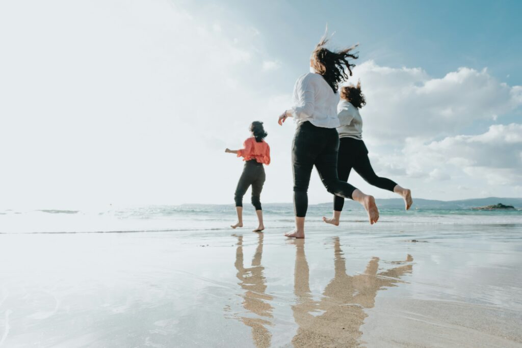 Three friends having fun on Gulfport Beach near Bayberry RV Park on the gulf coast of Mississippi.