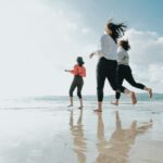 Three friends having fun on Gulfport Beach near Bayberry RV Park on the gulf coast of Mississippi.