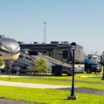 Big rig RVs parked on spacious concrete sites at The Station RV Resort in Madison, Florida