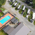 Overhead view of Twin Oaks RV Park in Elko, GA showing spacious RV sites, pool area, playground, and open lawn space for games and outdoor activities.