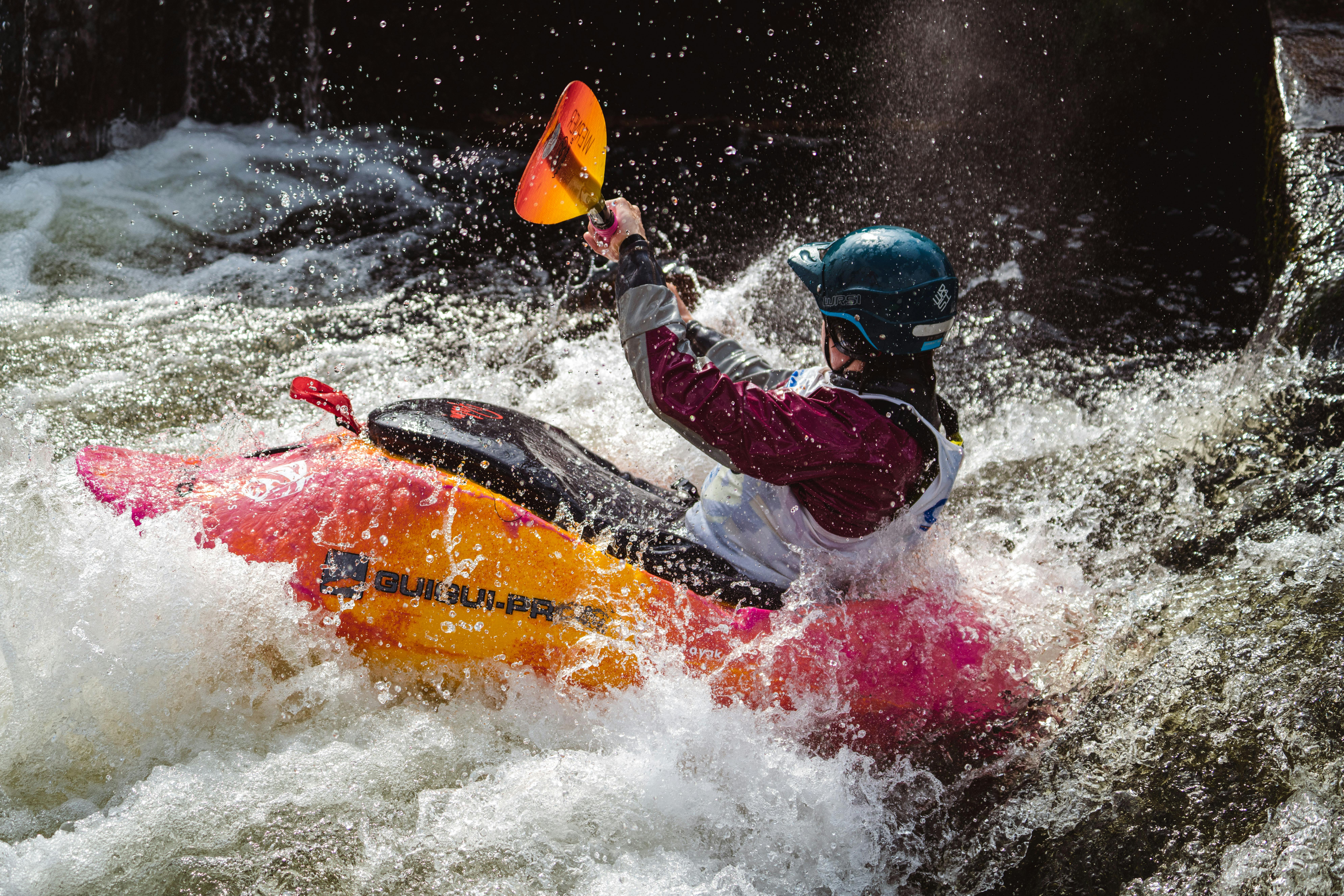 River kayaker in the rapids at the Bigfork Whitewater Festival, just outside Polson, Montana.