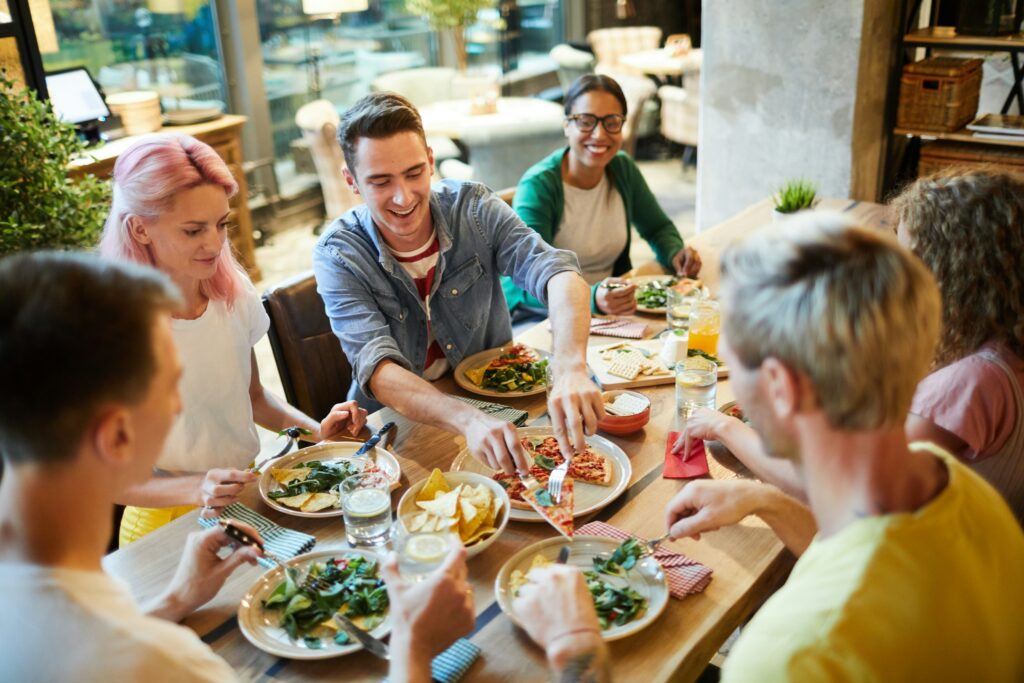 Friends eating at a laid back local dining spot to eat near North Landing Beach RV Resort in Virginia Beach
