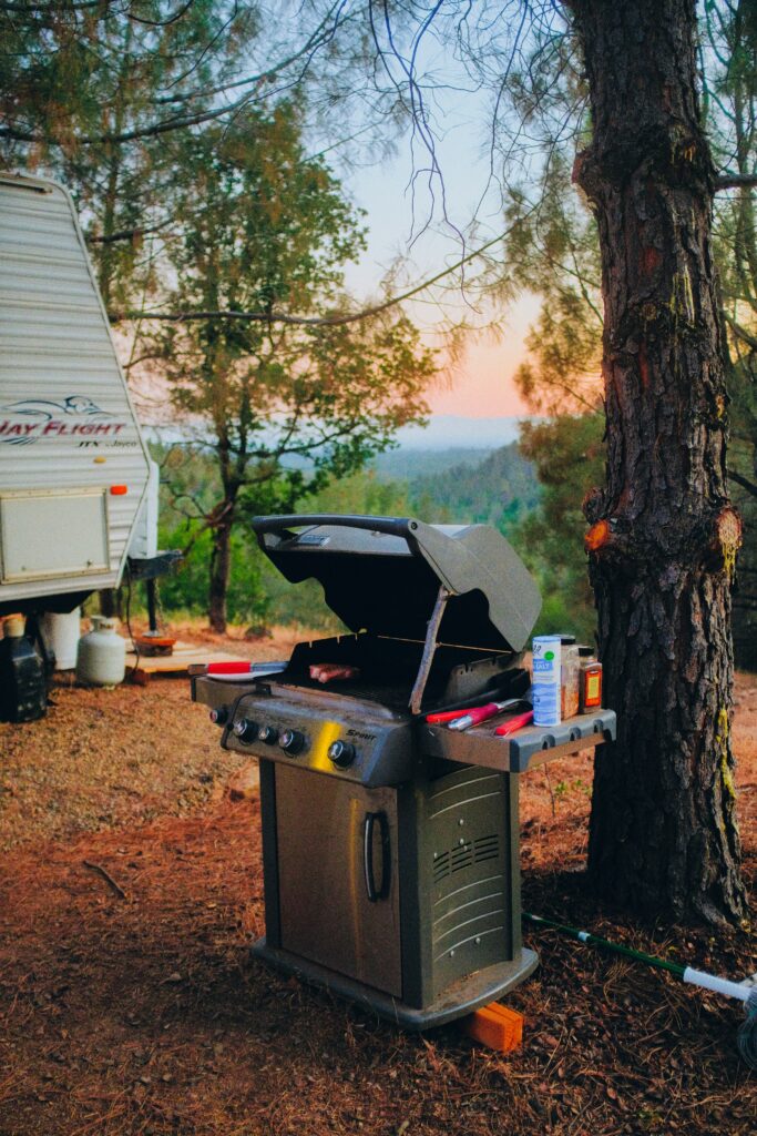 cooking outside on a portable bbq at your Streamside RV camp site