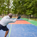 Guests enjoying a round of pickleball over Labor Day Weekend at Americamps RV Resort just outside Richmond, Virginia.